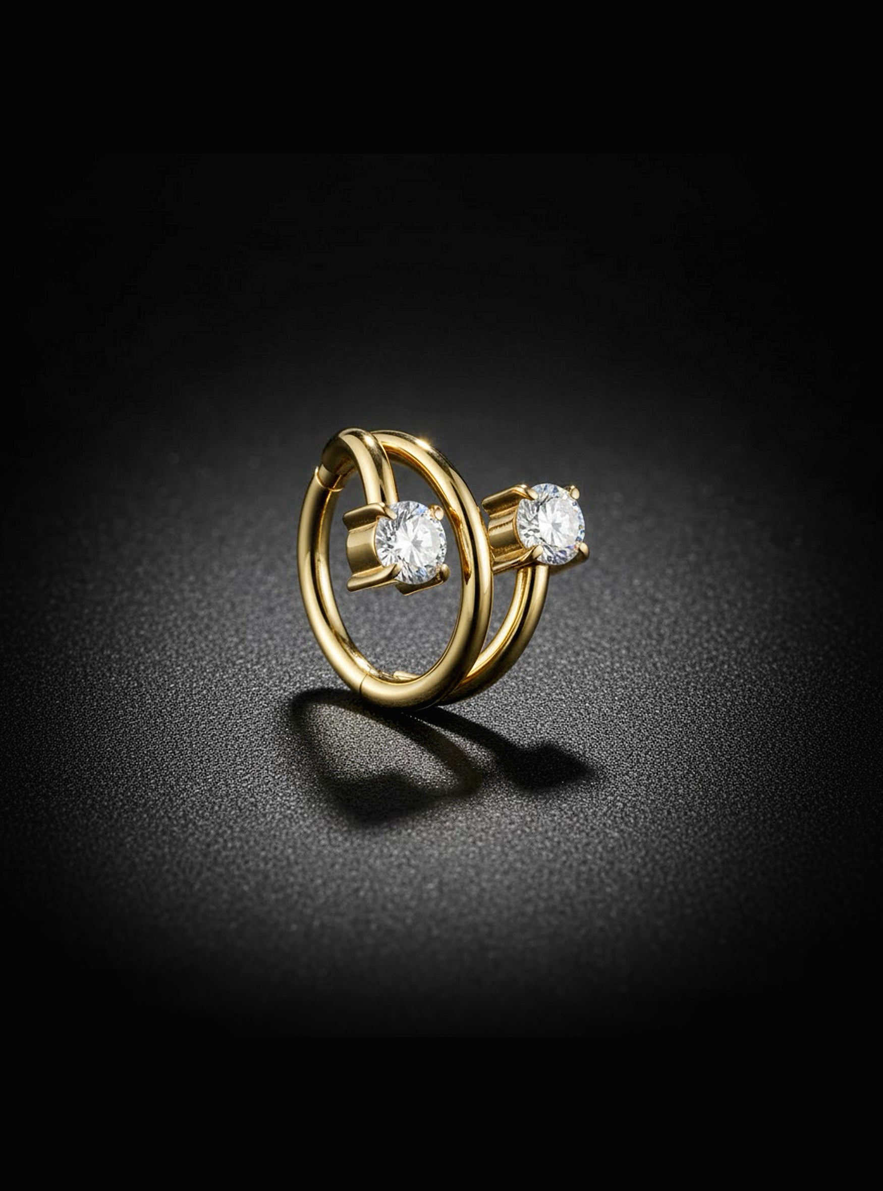 Gold earring with two diamonds on a dark background