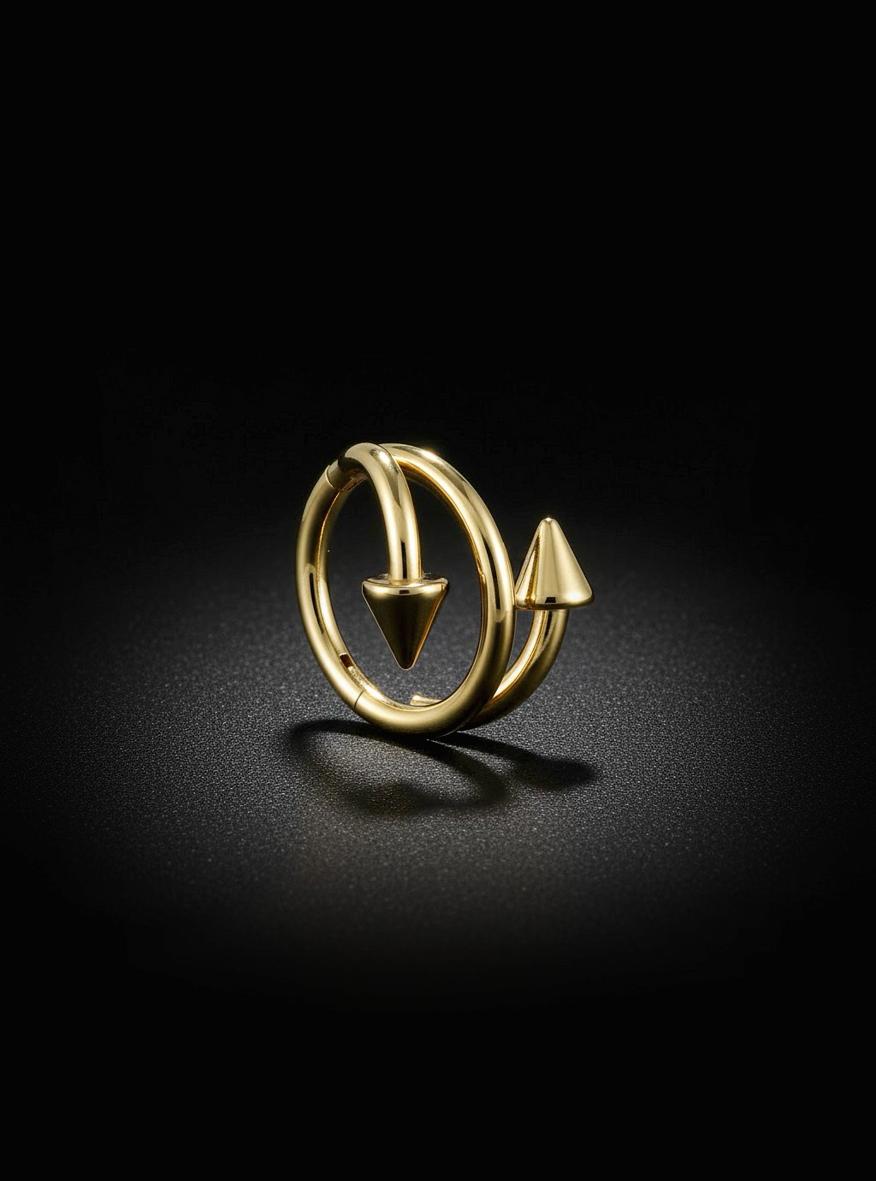 Titanium Yellow Gold earring with a Spike design on a black background