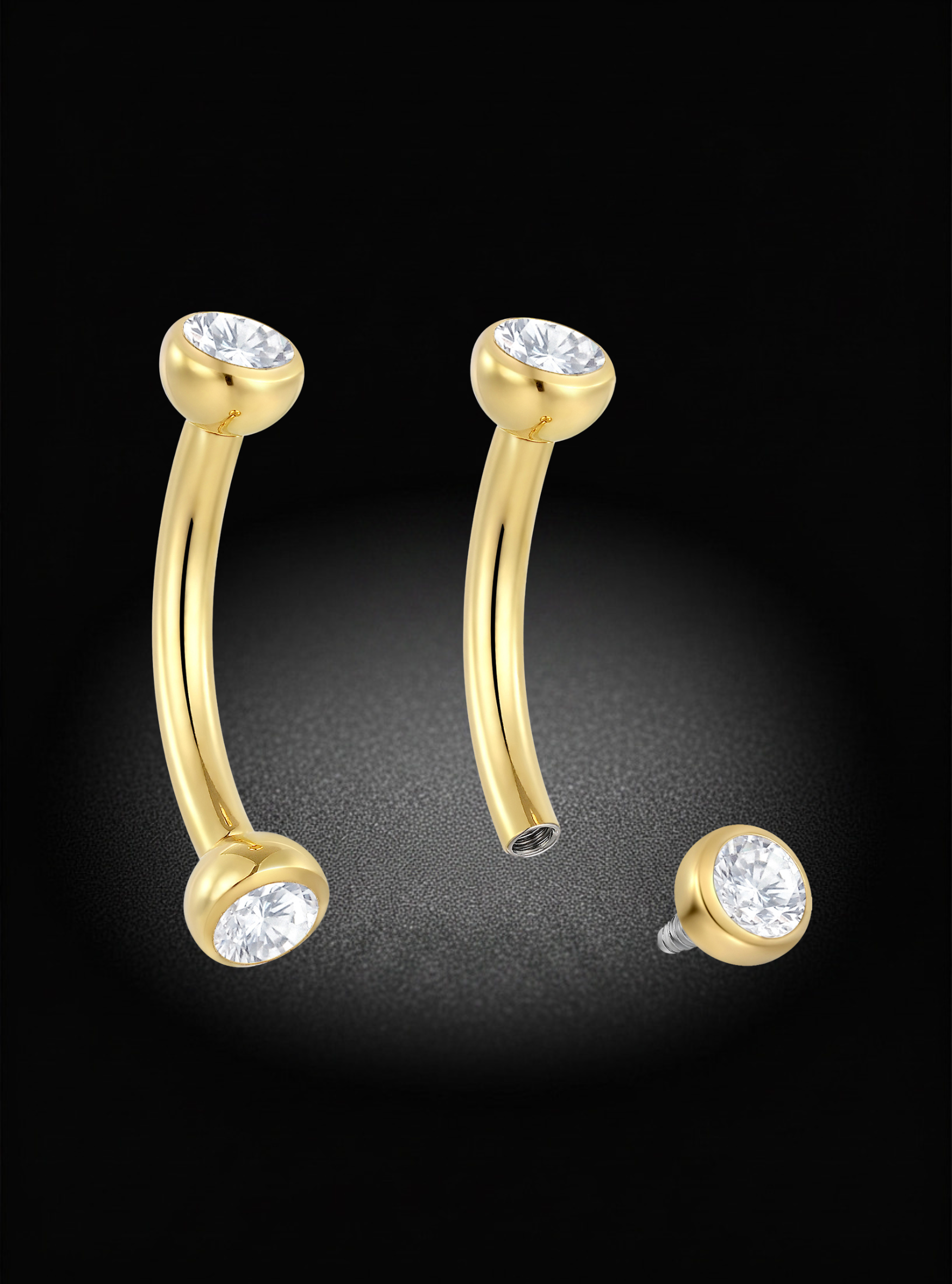 Gold curved barbell stud earrings with clear gemstone accents, shown on a black background with one earring displayed upright and another broken into two pieces to show the post detail.
