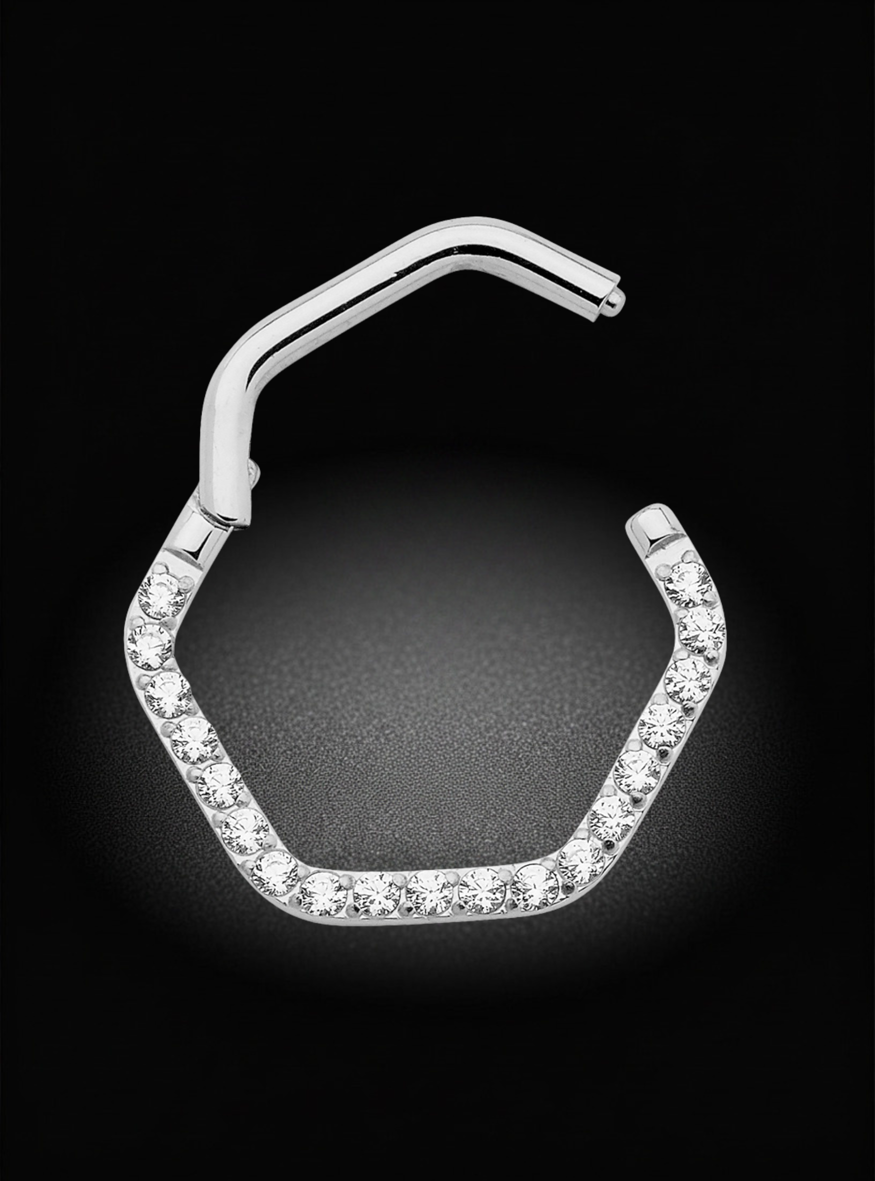 A silver-toned hexagonal hoop nose ring embellished with clear pavé stones, shown on a black background.