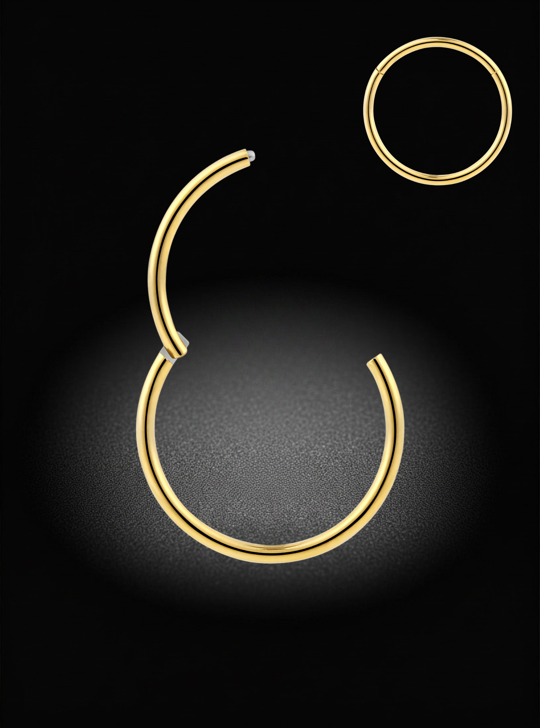 Gold-toned hoop earrings shown on a black background, with one large open-ended hoop centered and a smaller matching hoop in the upper right.