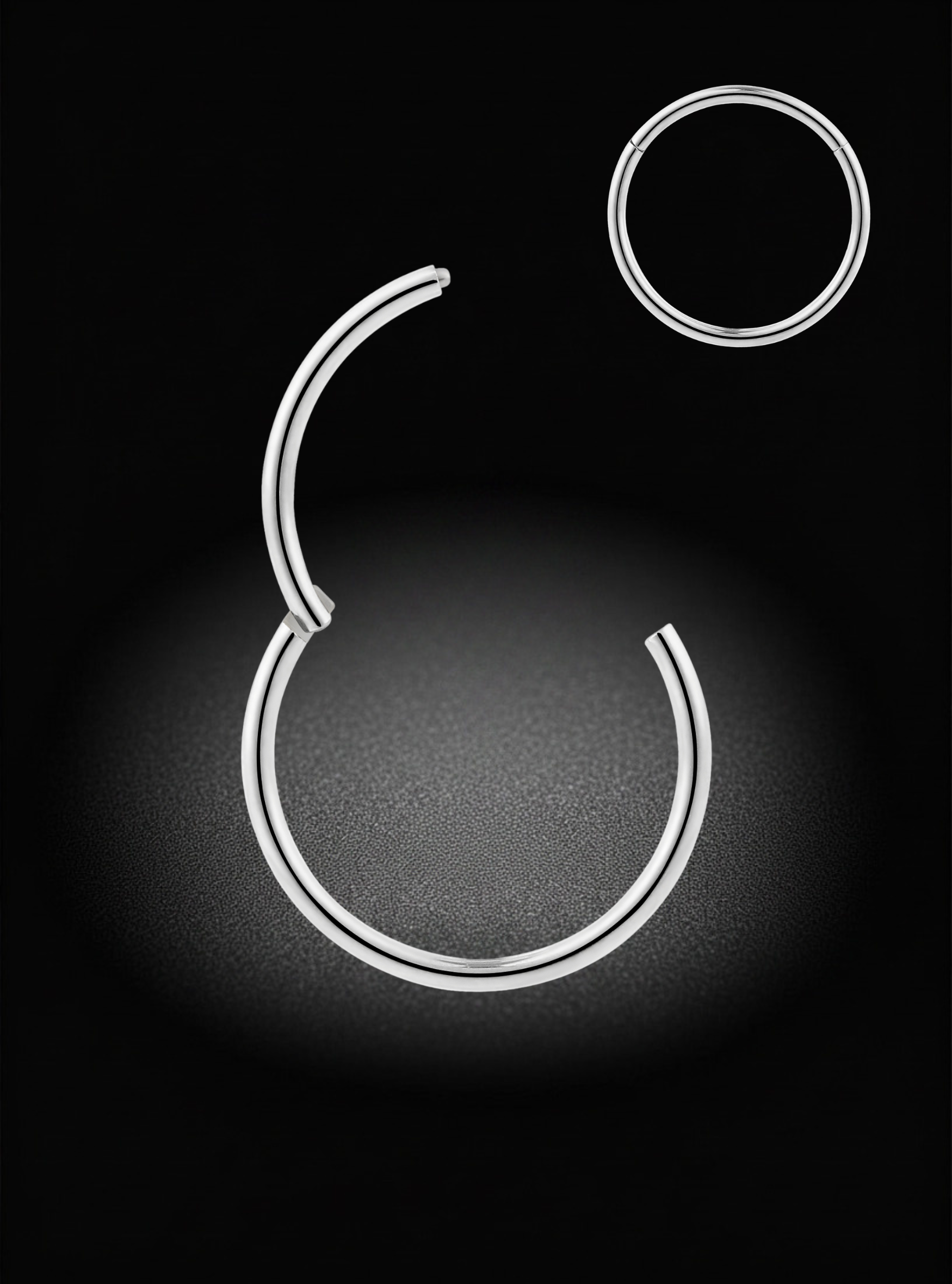 A pair of minimalist silver-toned hoop earrings on a black background, with one larger open-ended hoop and one smaller circular hoop, both glowing with a soft white light.