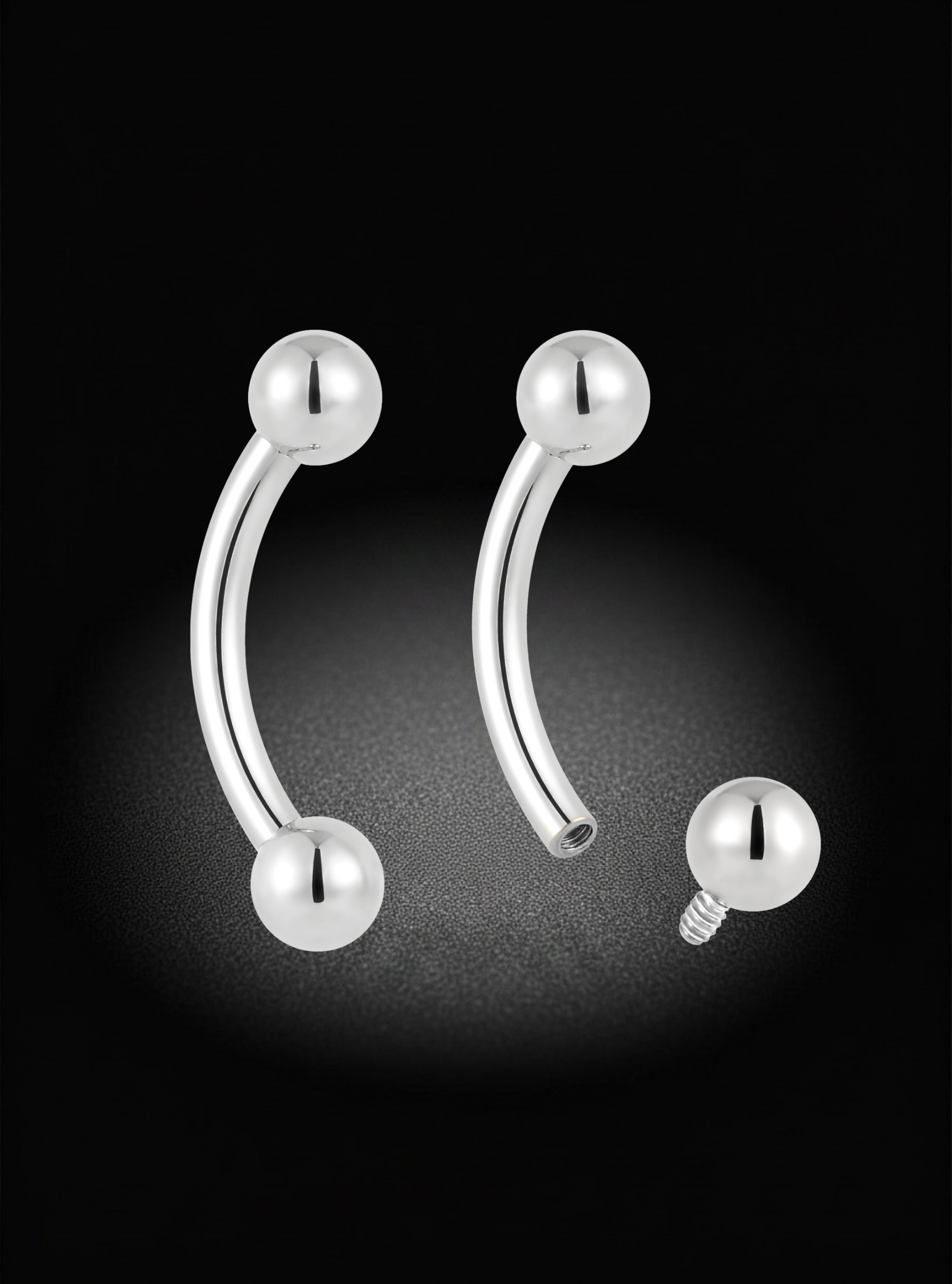 Silver curved barbell piercing jewelry with pearl-like ball end studs, shown on a black background with one piece displayed assembled and another shown with the screw-back clasp separated.