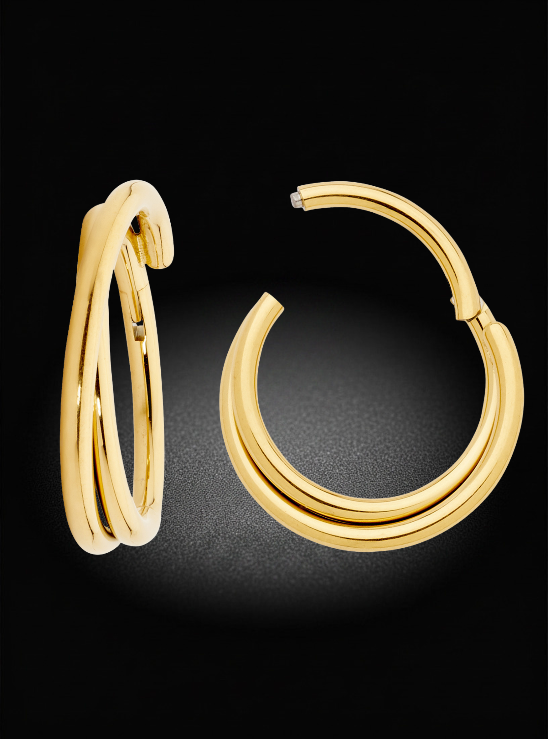 A pair of polished yellow gold hoop earrings with a unique triple-band design, displayed on a dark textured background.