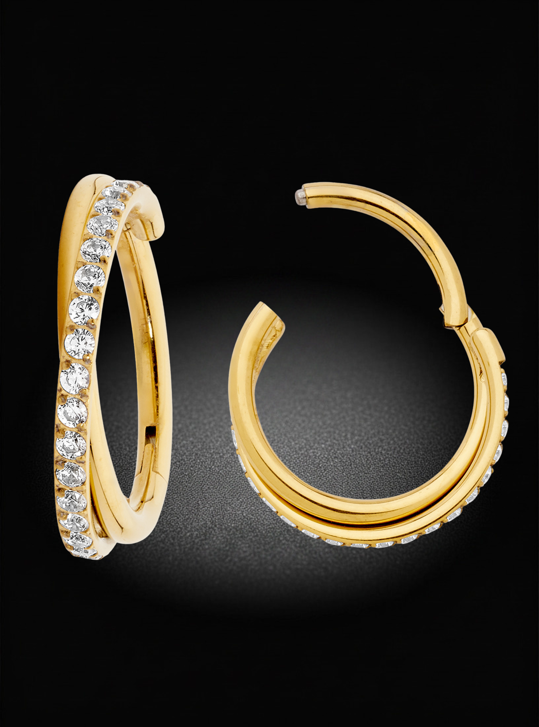 A pair of gold hoop earrings with rows of clear pavé-set stones, shown on a black background. One earring is shown upright and the other is angled to show the open back clasp.