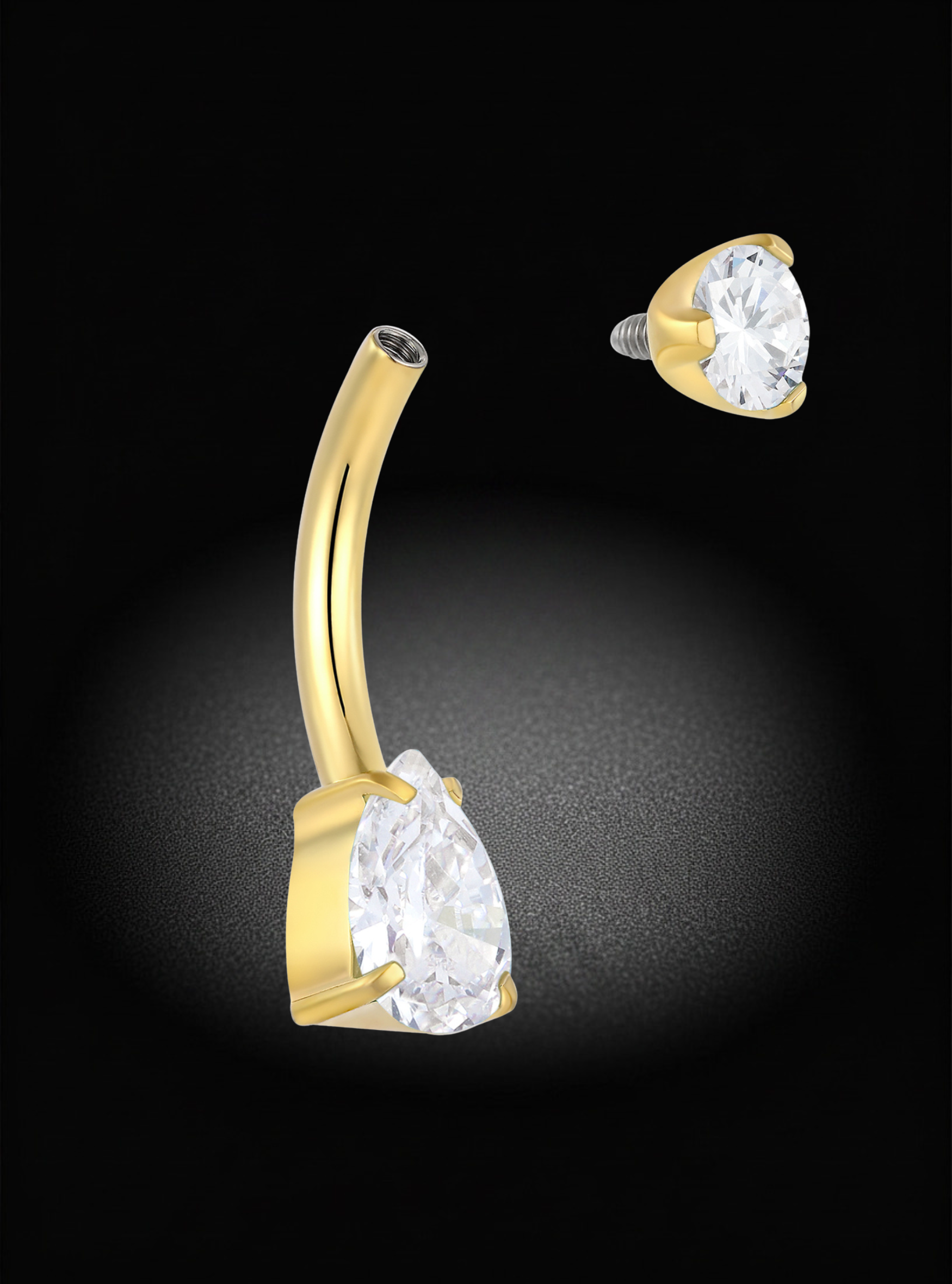 Gold curved barbell piercing stud with a large clear teardrop gemstone, shown from front and side angles on a black background.