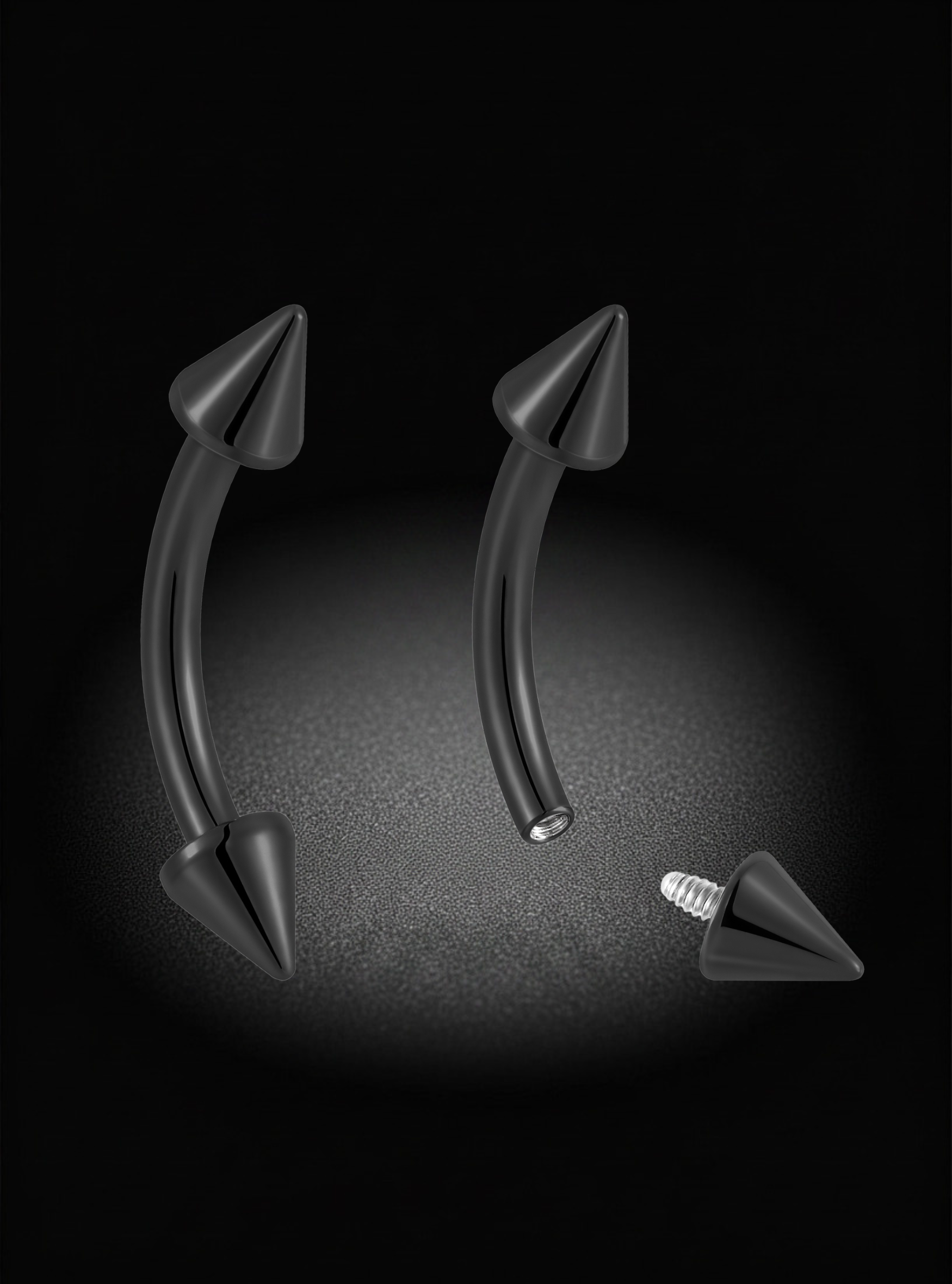 Two curved black barbell-style body jewelry pieces with pointed ends, shown on a dark background with one piece separated to show the screw-back end.