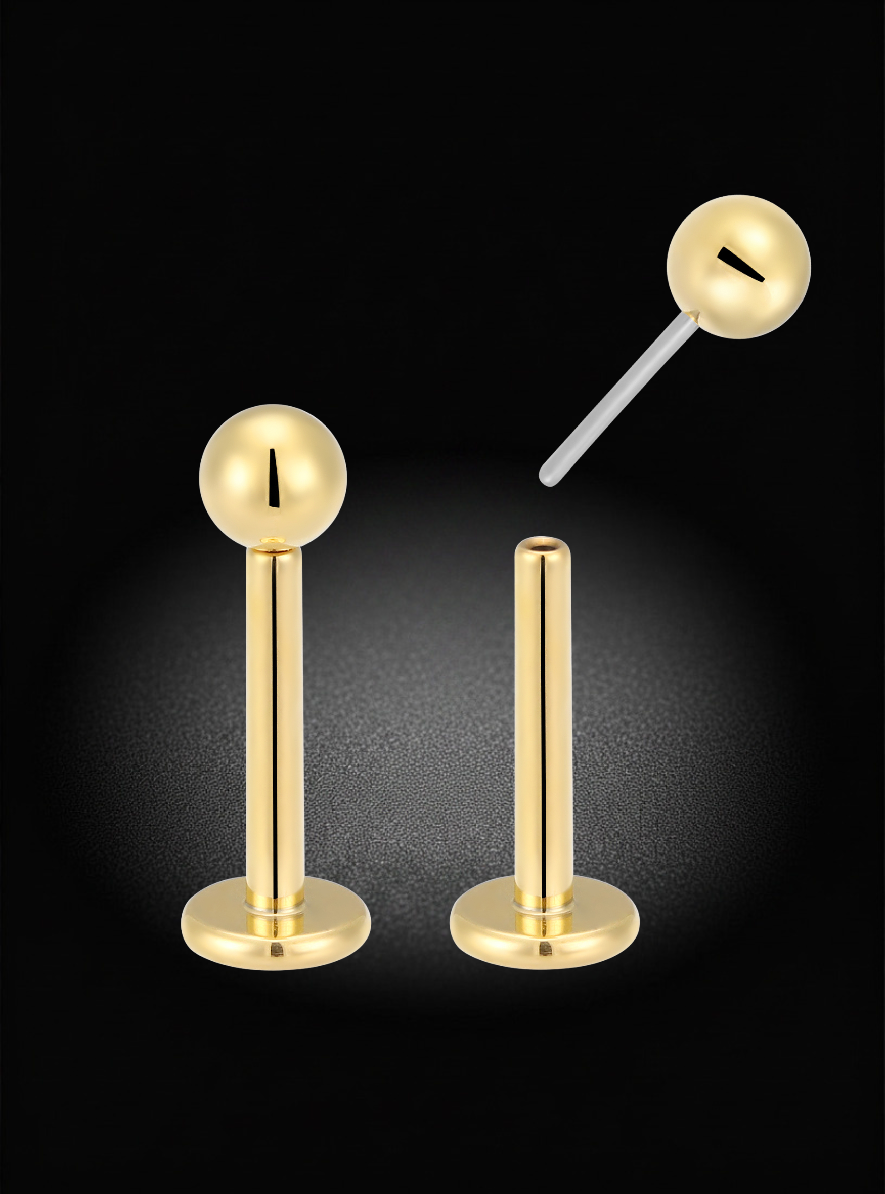 Two gold-tone body jewelry piercings shown on a black background, including one with a ball end and one without, plus a floating close-up of the ball end.