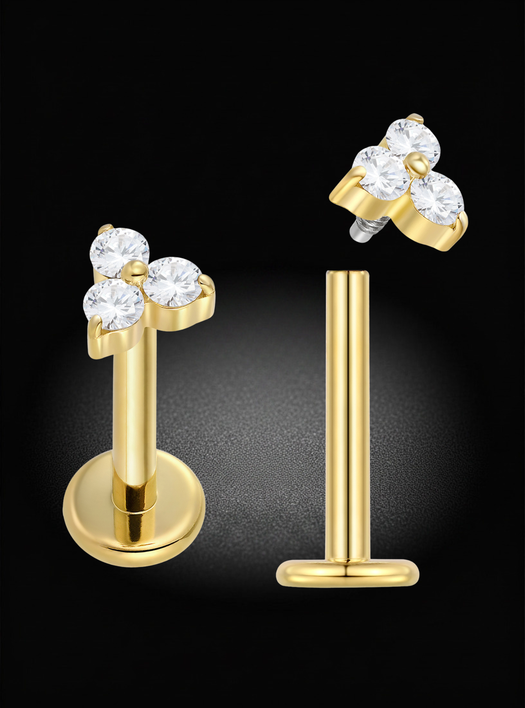 Gold body jewelry set featuring a flat-back labret stud with a three-stone floral cluster and a matching flat-back post, shown on a black background.