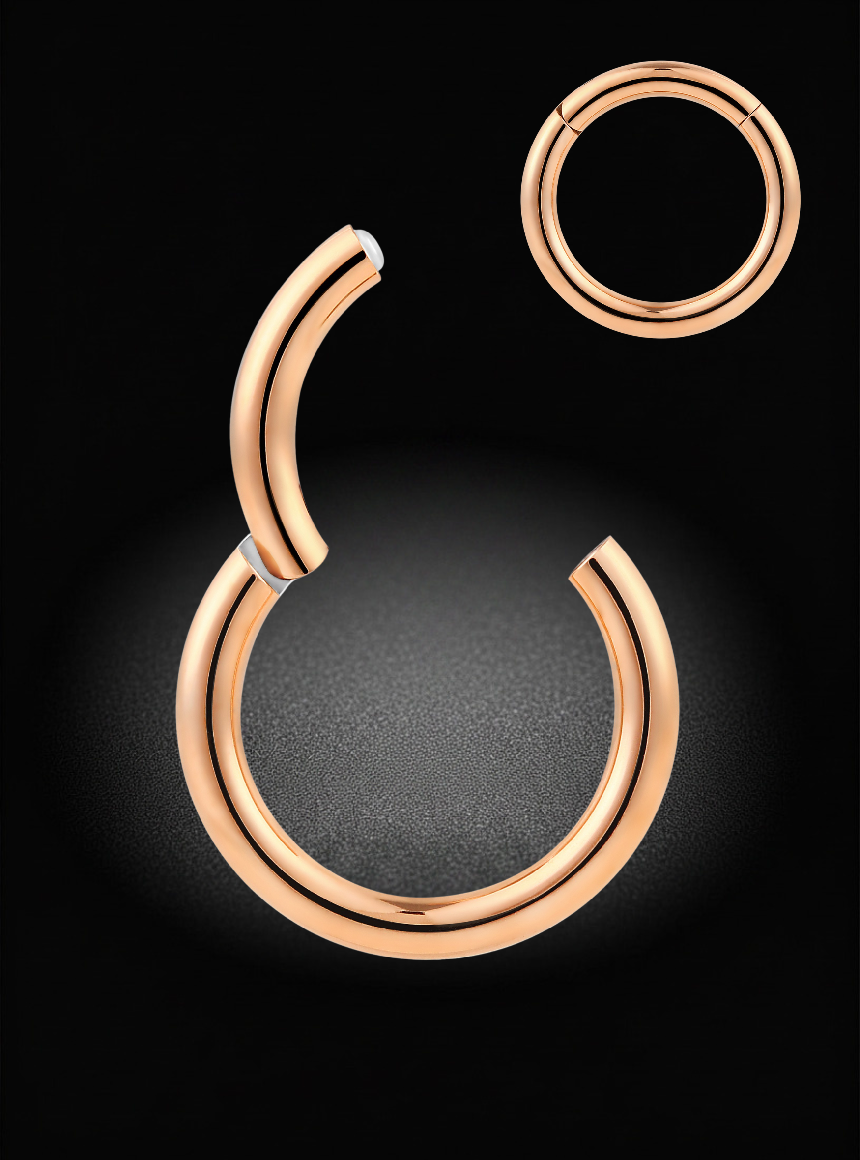 A pair of rose gold hoop earrings, with one shown as a larger open-ended hoop and the other as a smaller closed hoop, set against a dark black background with a soft glow.